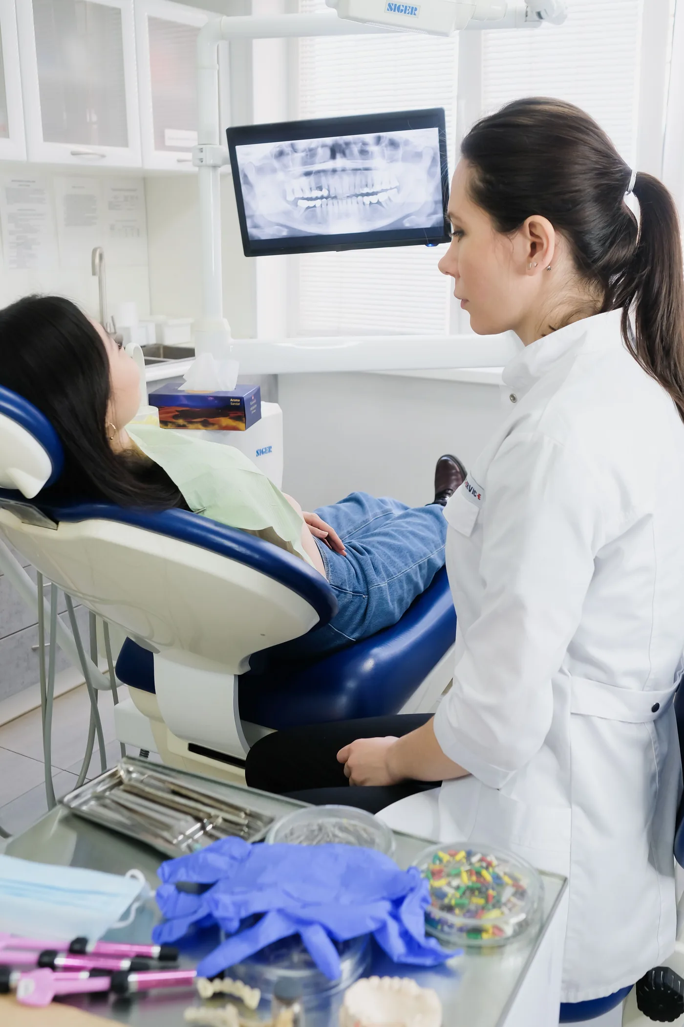Illustrative dentist explaining a dental X-ray to a patient